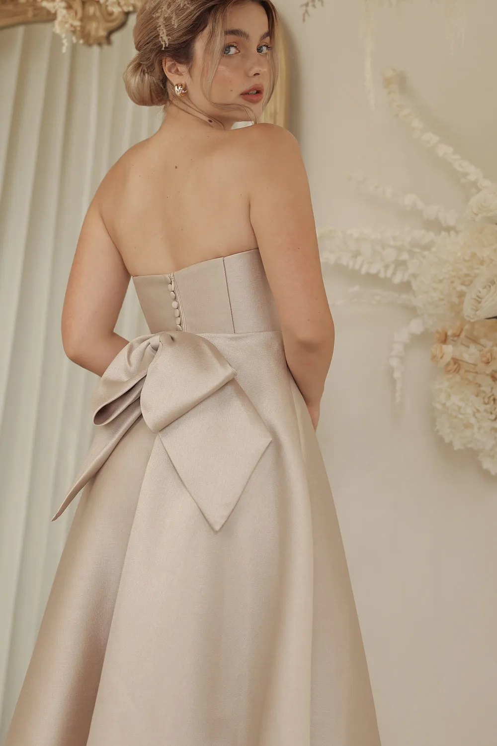 CELINE Strapless Curved Neckline Mid Length Gown with Bow, Pockets and Covered Buttons (Tan Gazaar)