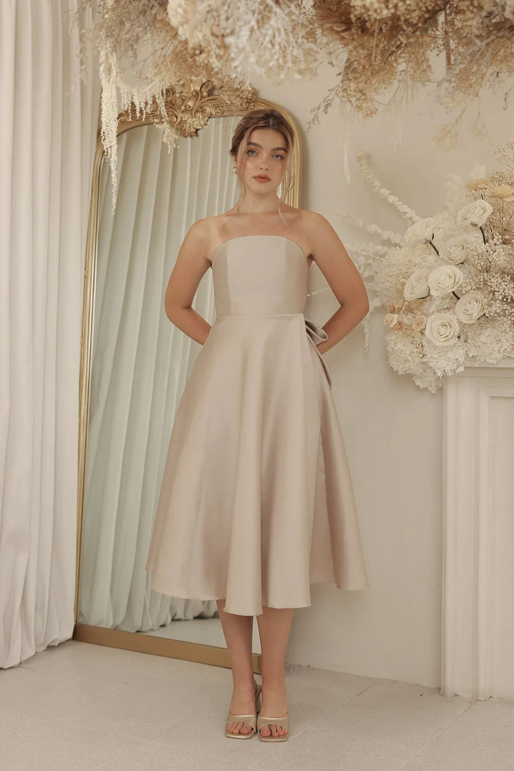 CELINE Strapless Curved Neckline Mid Length Gown with Bow, Pockets and Covered Buttons (Tan Gazaar)