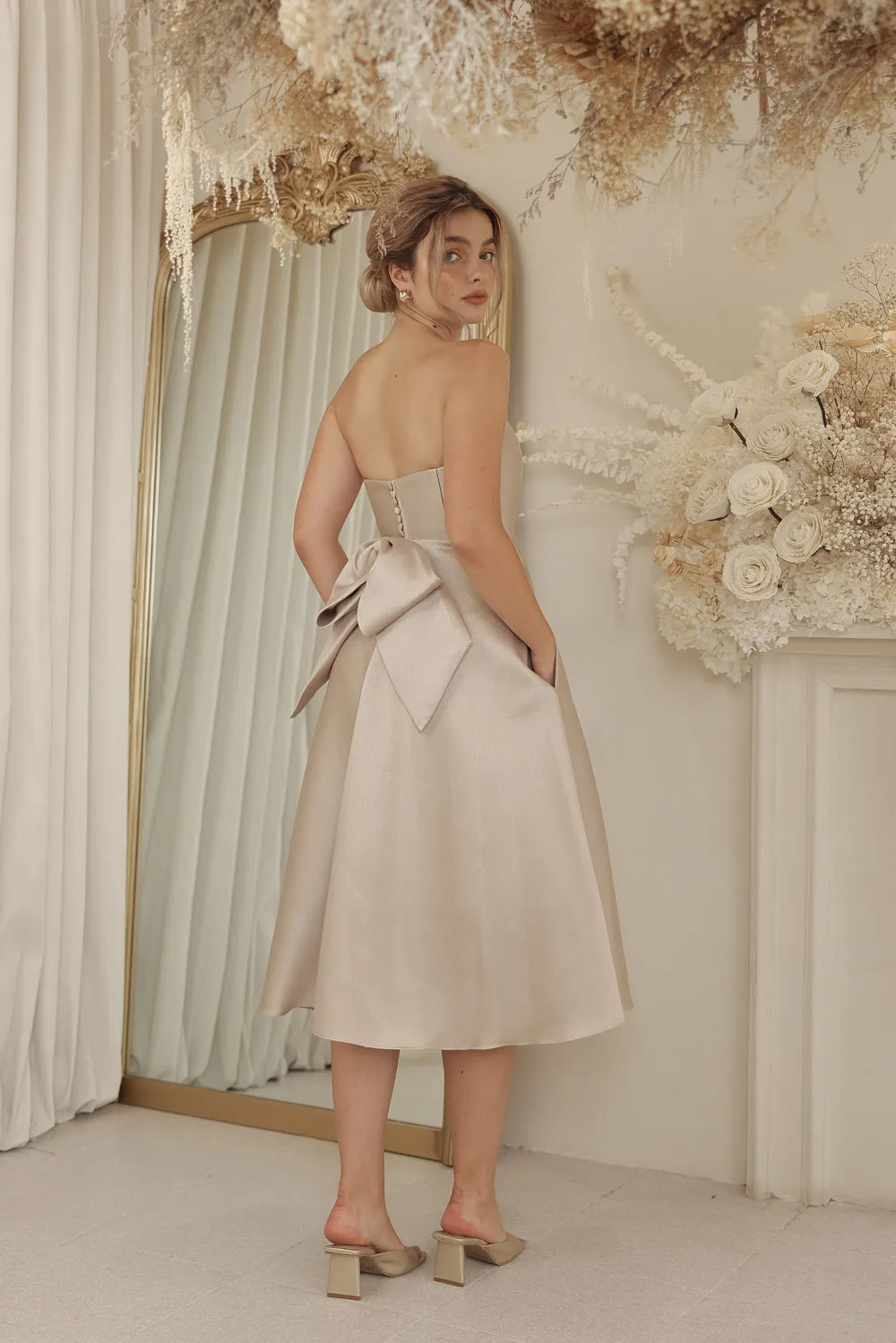 CELINE Strapless Curved Neckline Mid Length Gown with Bow, Pockets and Covered Buttons (Tan Gazaar)