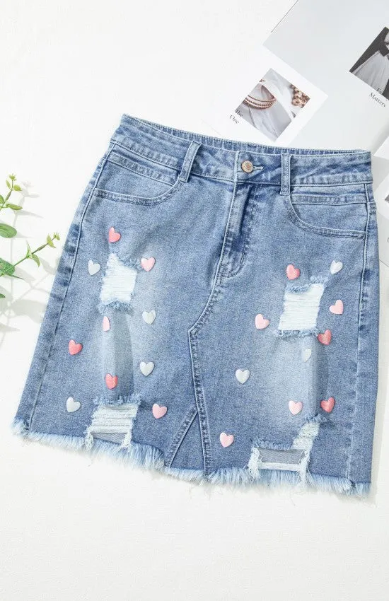 The Heartbreaker Skirt – Distressed Raw Hem Denim with Heart Detail
