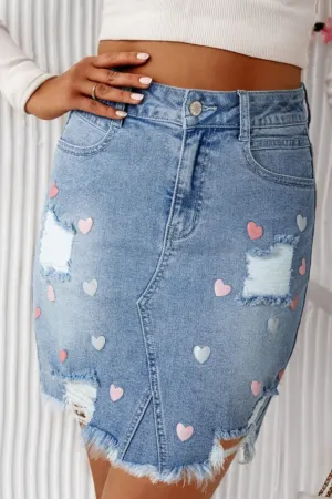 The Heartbreaker Skirt – Distressed Raw Hem Denim with Heart Detail