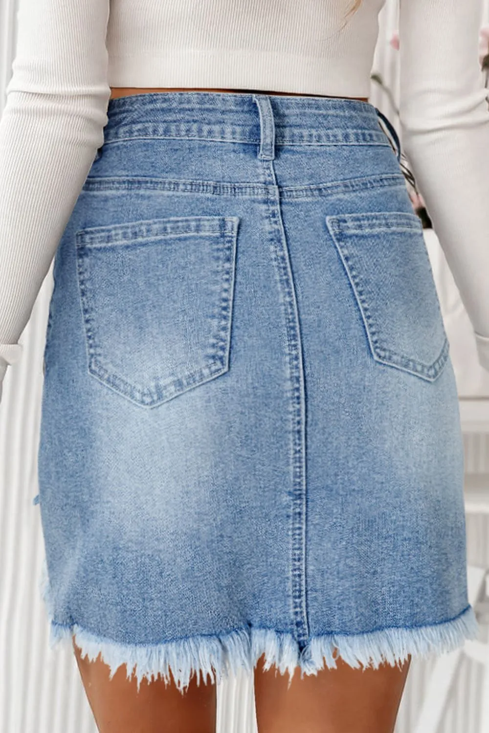 The Heartbreaker Skirt – Distressed Raw Hem Denim with Heart Detail